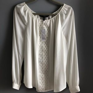 White blouse with beautiful decorative placard